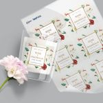 image of custom printed labels on sheet and adhered to candle next to flower
