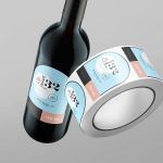image of custom printed labels on roll and adhered to wine bottle