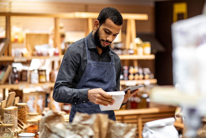 Man taking inventory at his small business