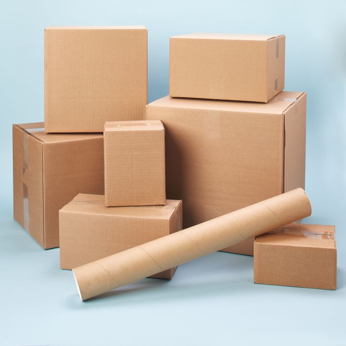 Stack of eight shipping boxes and tubes showing how to pack and ship for less