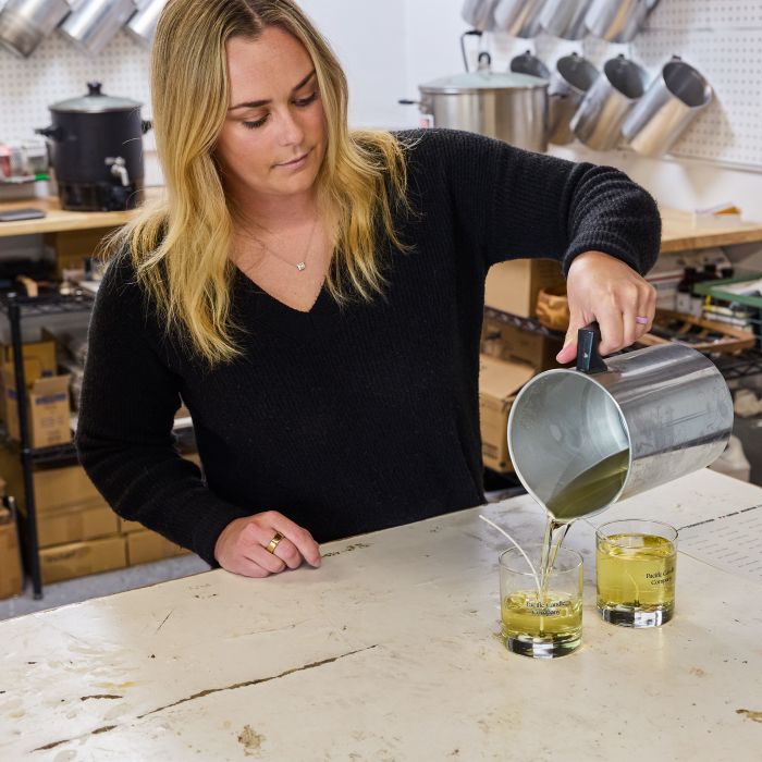 pacific candle co pouring wax in candle containers