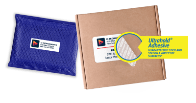 A blue poly mailer and a cardboard shipping box with shipping labels adhered to each and a magnifying glass zoomed in on the box's label to showcase Avery's Ultrahold adhesive technology