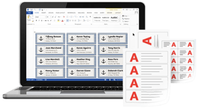 An open laptop displaying a screen with an address label template in Microsoft Word, with a blue anchor design. Next to the leptop are sheets of different size printed labels