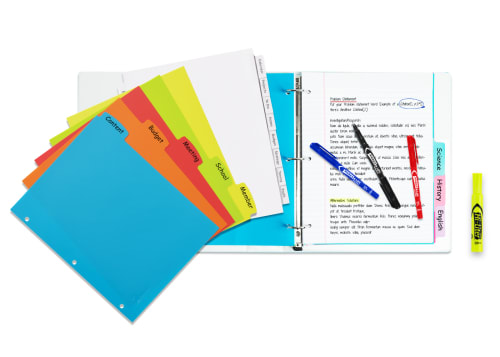 Flatlay of white binder with colorful dividers fanned out on top with highlighters and permanent markers strewn across