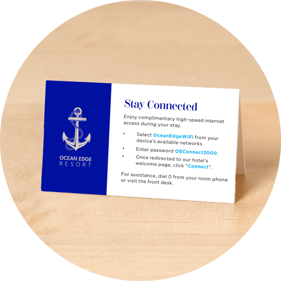 Avery tent card with a beachside hotel design, featuring guest wifi information.