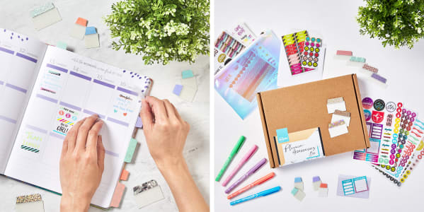 A planner being decorated with pastel repositionable tabs and a gorgeous collections of planner supplies on a white table