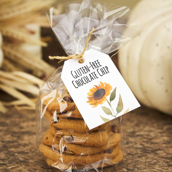 A cute and simple sunflower is printed on Avery tag 22802. The tag is attached to a bag of cookies and reads, "Gluten-free chocolate chip."