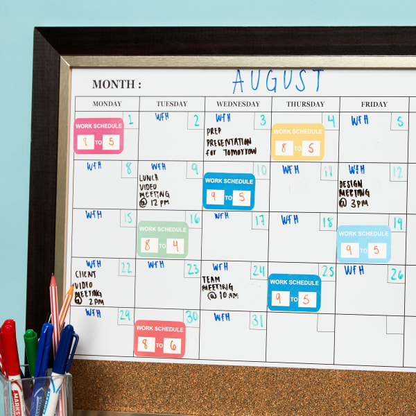 Avery decals 61512 shown printed with a calendar appointment sticker template. The removable stickers are adhered on a white board and written on with permanent marker. 