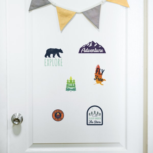 Outdoor-themed sticker templates shown applied on a painted interior door. 