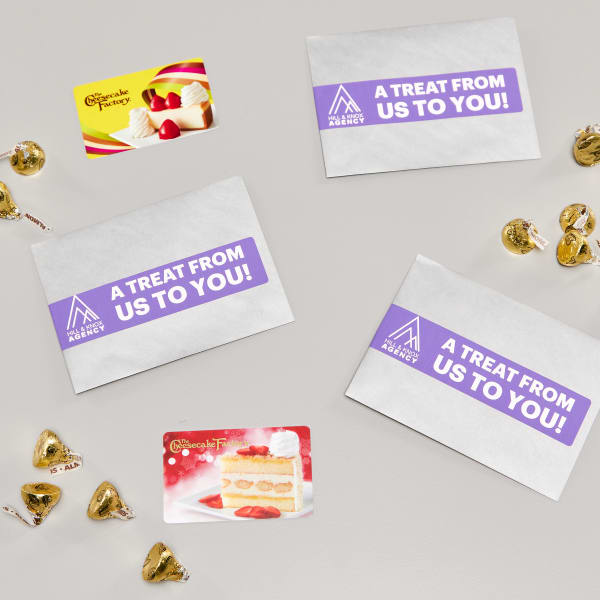 Small gift card bags with Avery wrap around labels that read "A treat from us to you!"