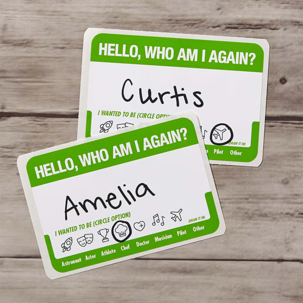 An example of ice-breaker name tags for work functions. The name tag reads, "Hello, Who Am I Again?" with a space for a handwritten name. Then there are icons guests can circle to answer the question of who they wanted to be when they grew up.