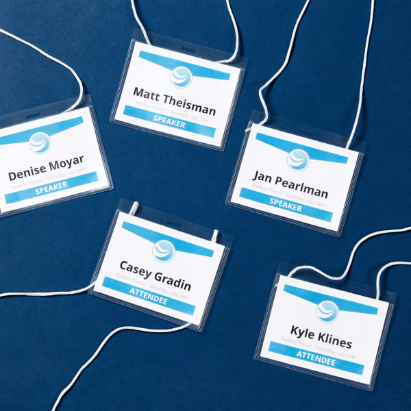 Examples f branded named tags for big events like a conference or convention. The template used for these name badges feature the company logo and colors, individual names, and the role of the person at the event.  