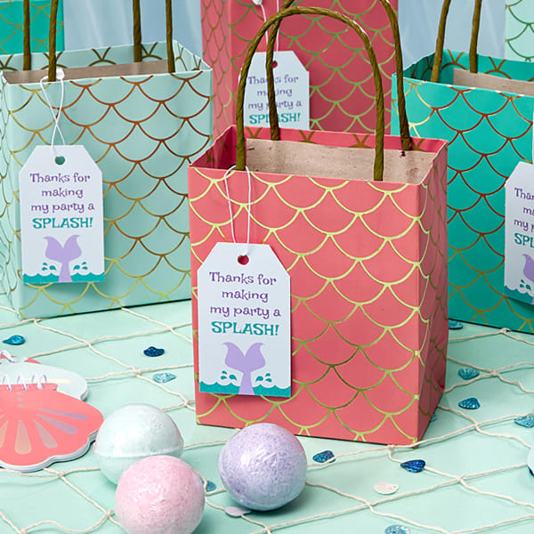 Scale-print gift bags are shown personalized with Avery 22802 tags that read, "Thanks for making my party a splash!"