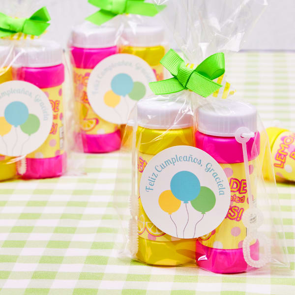 Bubbles and labels are combined to personalize birthday party favors. The bubble bottles in this photo are personalized with Avery 22807 round labels. 