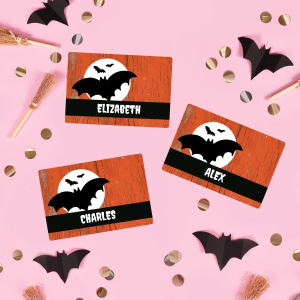 Avery name badges 8395 printed with a red, black and white bat template and personalized with individual names. 