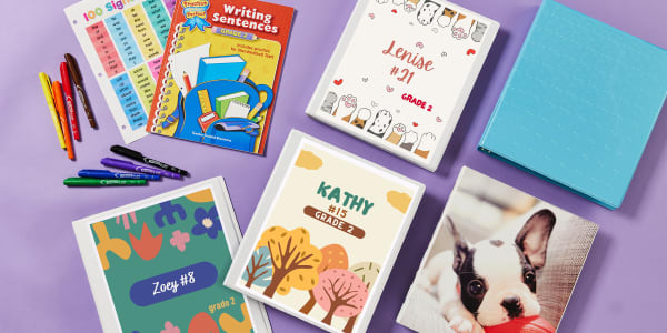 An artistic layout of the best binders for elementary school kids. Avery durable 1/2 inch, 1 inch, and 1-1/2 inch white view binders are shown with personalized binder covers. Avery fashion binders with a blue holographic cover and French bulldog puppy cover are also shown. 
