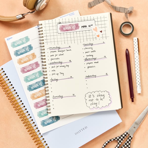 Custom planner stickers for weekly bullet journal spreads made with Avery 5261 labels. The labels feature a free, customizable Avery template. 