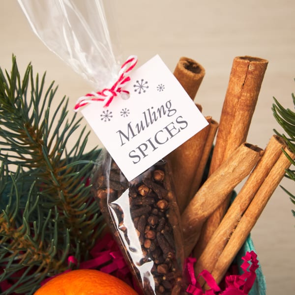 Gift tag for mulling spices Christmas gift is printed on square Avery tag 22849. There are simple snowflakes and it reads, "Mulling Spices."