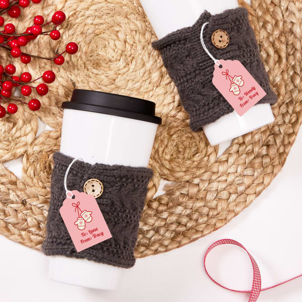 Coffee cozies personalized with Avery tag 22848. The tag design is pink with winter mittens and text for writing "to" and "from."