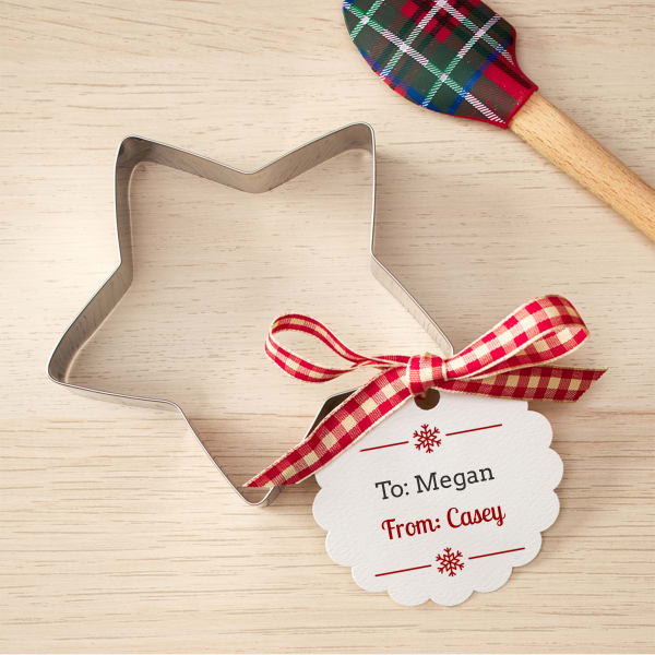 Simple snowflake tag for cookie cutter gifts printed on Avery 80511 round scalloped tag. A simple red snowflake design with personalized "To and From" text. 