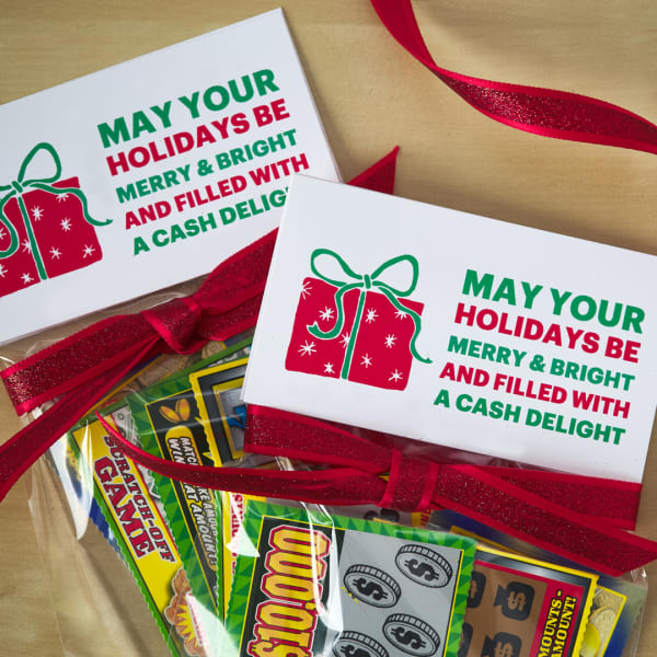 Scratchers Christmas gift for coworkers is printed on Avery 5302 small tent cards. The design is red and green with a red present and the text reads, "May your holidays be merry & bright and filled with cash delight."