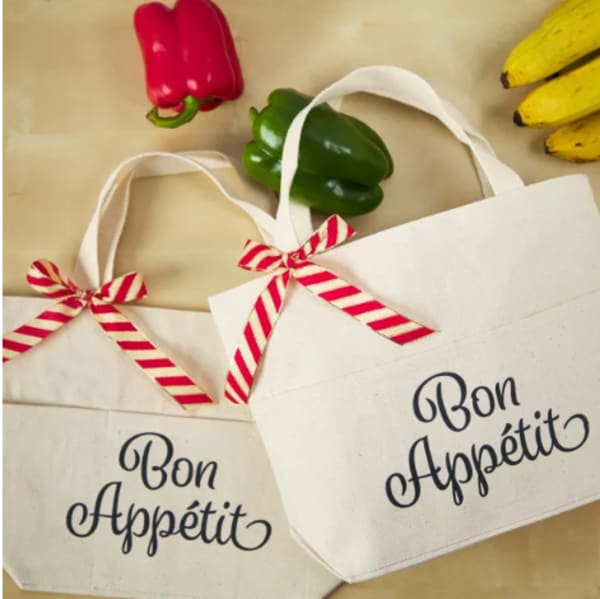"Bon Appétit" coworker Christmas gift idea made with a canvas tote bag and Avery fabric transfer 3271. The design reads, "Bon Appétit" in a pretty cursive font. 