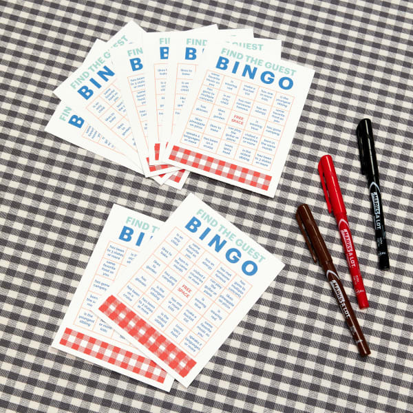 A cardboard box filled with ingredients to make s'mores, including graham crackers, a Hershey's chocolate bar and marshmallows. On the front of the box is a square Avery label 22816 that reads, "We Need S'more Employees Like You."