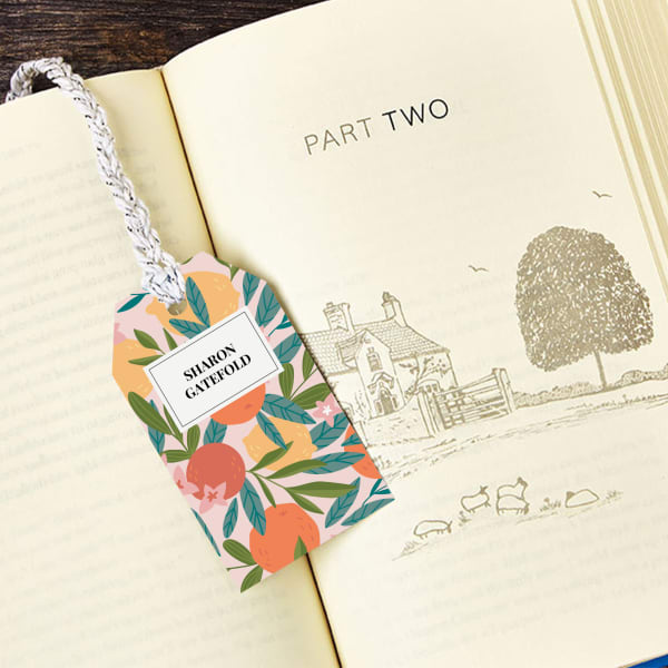 A printable bookmark template with an elegant floral design printed on an Avery tag.