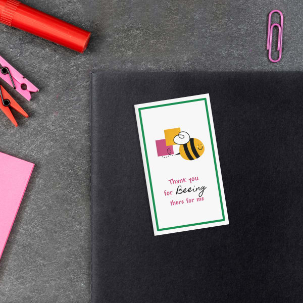 A printable bookmark design of a bee with a "Thank you for bee-ing there for me" pun printed on an Avery business card.