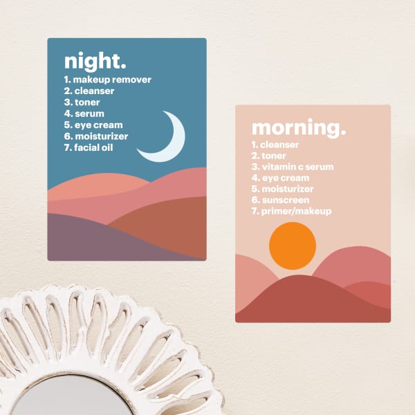 Adhesive posters for skincare organization are shown printed on Avery Surface Safe wall decals 61514. One poster is a landscape in blue and cool tones with a moon and has the steps for a nighttime skincare routine. The other poster is a landscape in pink and warm tones with a sun and has the steps for a morning skincare routine. 