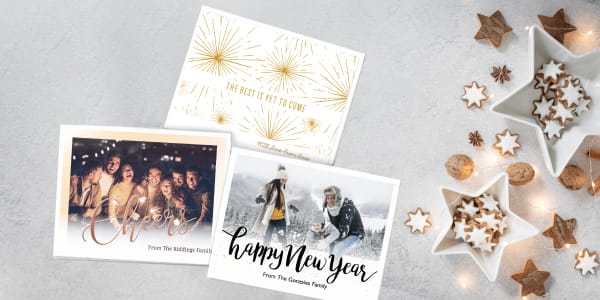 Image of quick Christmas card ideas using three predesigned New Year's cards made from free Avery templates. Holiday cards are shown on a silver and white holiday background.