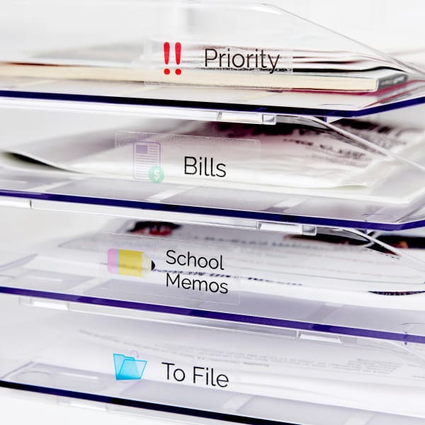 Clear letter trays are labeled to help declutter incoming mail. Each tray is labeled with an Avery 6521 label for priority, bills, school memos, and papers to file. 