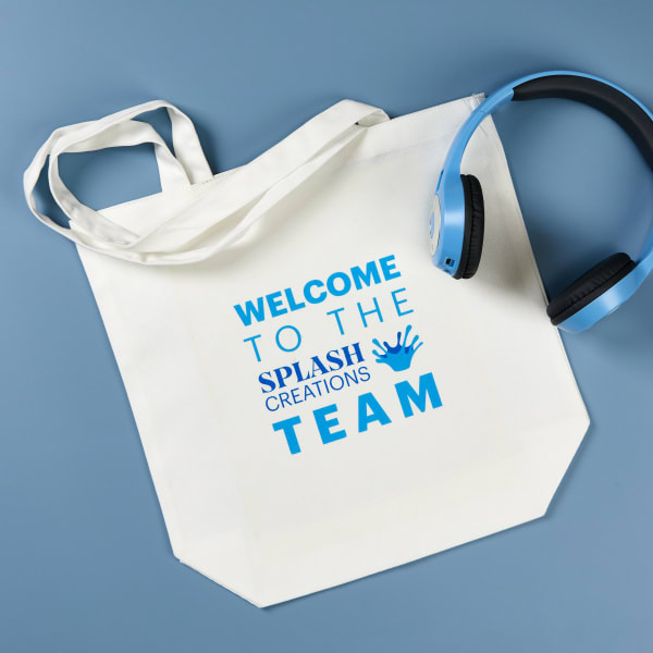 A customized tote bag for an onboarding welcome kit. The tote bag features Avery printable fabric transfer 3271 printed with a customizable Avery template.