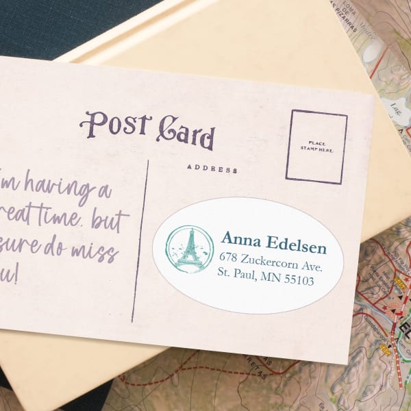 An example of how a 1-1/2" x 2-1/2" oval label fits on a postcard.