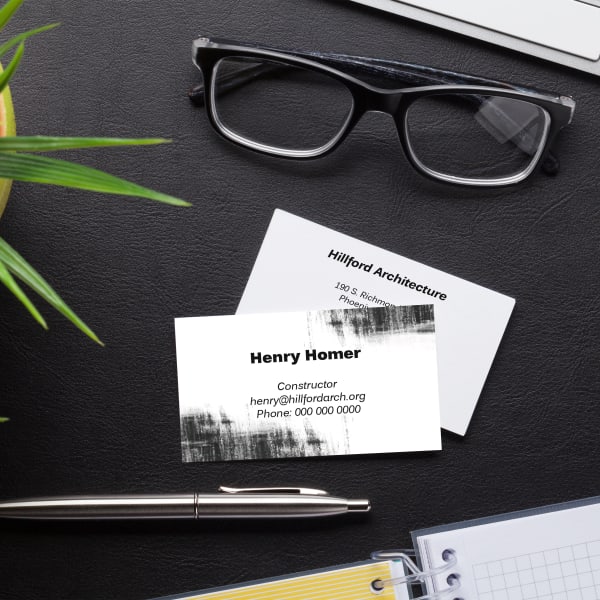 A modern business card template featuring an edgy grunge-style black and white design. Printed on Avery business card 28878.