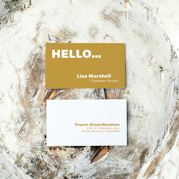 A modern business card template that uses a single color to make it pop. The design features a deep mustard yellow background with white text on the front and a white background with mustard yellow text. Printed on Avery 28878 business cards. 