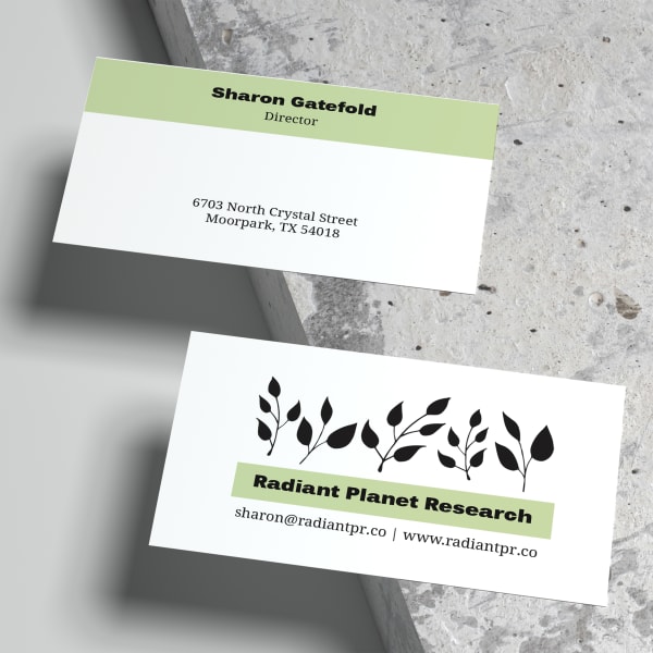 A fresh business card design featuring a pop of spring green. Printed on Avery business card 28878 and shown on a concrete background. 