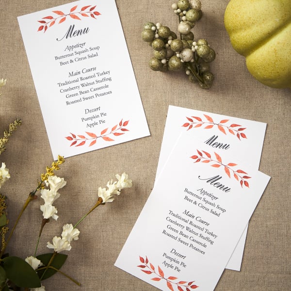 Menu cards for a simple Thanksgiving table setting. An orange leaf motif is featured on the Avery template for postcard 8386.