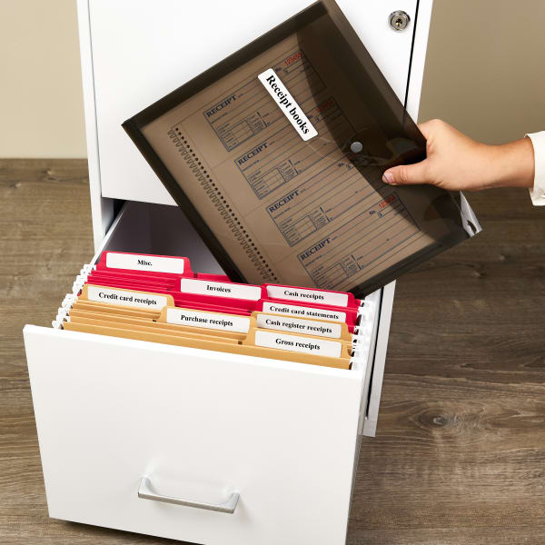 An example of how to organize receipts in a filing cabinet. The file folders are neatly labeled with Avery 5366 file folder labels and receipt books are kept in Avery 73556 expanding folder.