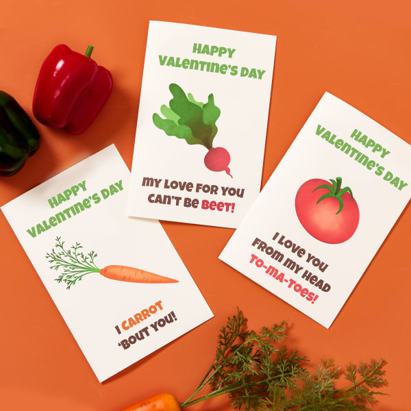 Avery 3378 half-fold cards are shown with three different designs. One features a carrot and reads., "I carrot 'bout you." Another features a beet and reads, "My love for you can't be beet." The third reads," I love you from my head to-ma-toes," and features a tomato.