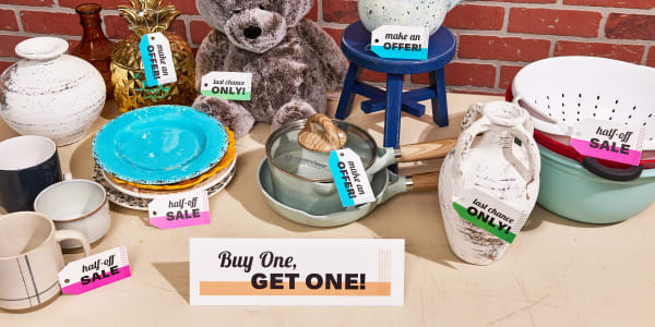 Image of table with garage sale item on top. Items have Avery tags showing incentives including half-off sale, buy one get one, and last chance only.
