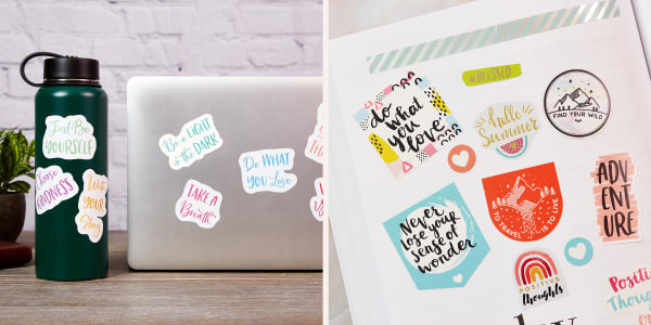 A water bottle, a laptop and a planner decorated with motivational stickers and phrases