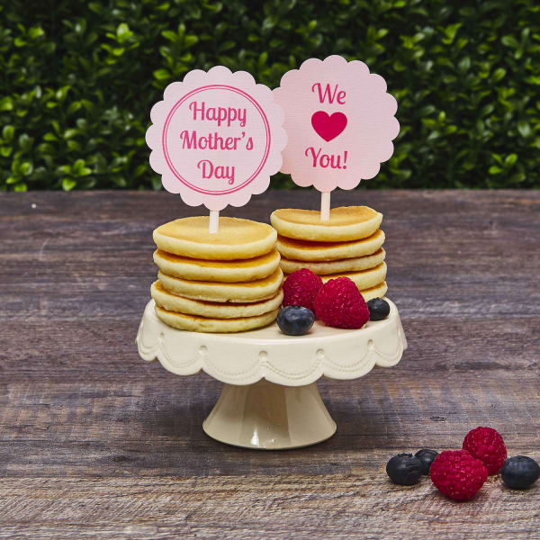 Pancakes with berries on cake stand