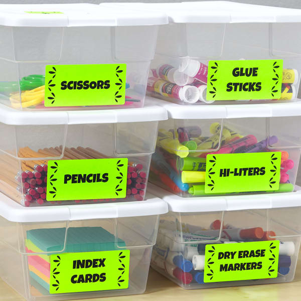 plastic supply bins labeled with colorful neon labels