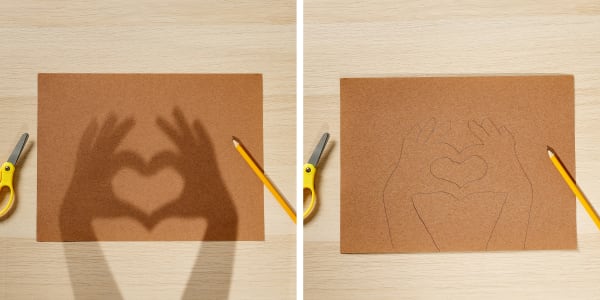 step one and two of heart hands valentine card showing casting a shadow of heart hands and tracing it on construction paper