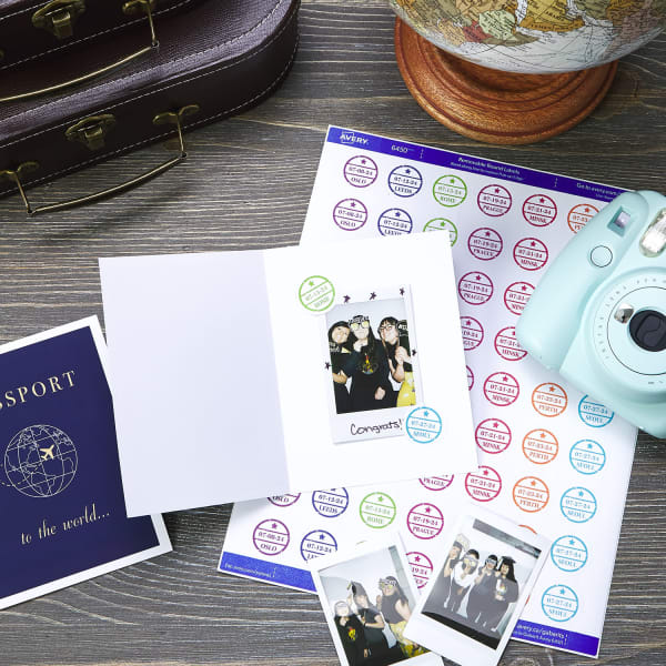 Avery 8315 note cards are printed with a passport design to make travel-themed party favors. Inside the card is shown an example of DIY stickers used to attach instant photos from the party. 