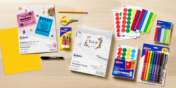 avery school supplies that can be used for birthday card crafts for kids artistically arranged on a light wood table includes blank avery greeting cards post cards and blank avery labels along with colorful color coding dots and marks a lot markers