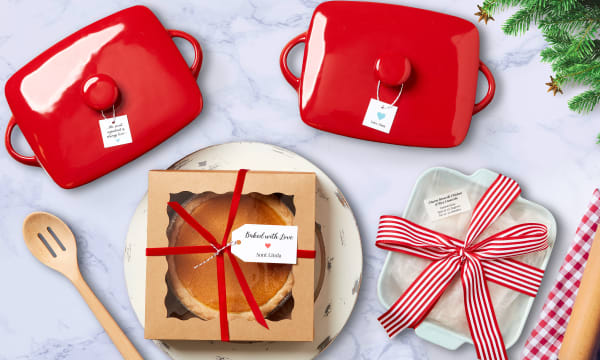 yummy pumpkin pie in a pastry box surrounded by festive red casserole dishes and kitchen accessories on a white marble counter top everything is decorated with avery tags and labels made using avery templates