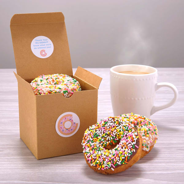 Sprinkle donuts in box with coffee