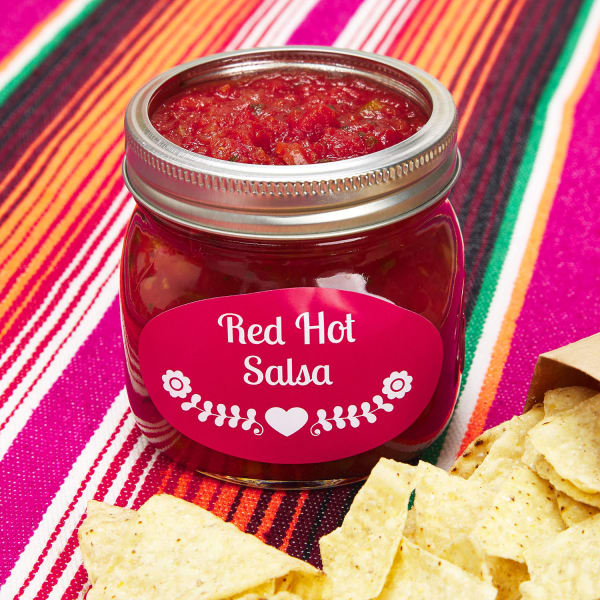 Open jar of red salsa
